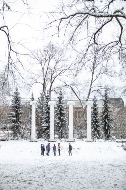 UW columns in snow with 5 people outside in winter clothing