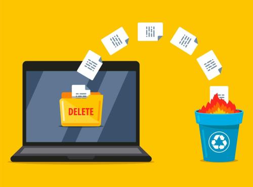 deleted files floating from laptop screen into recycle bin with fire inside