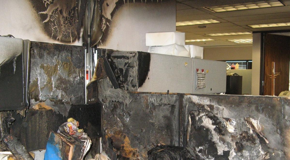 fire damage in an office cubicle due to a powerstrip burn